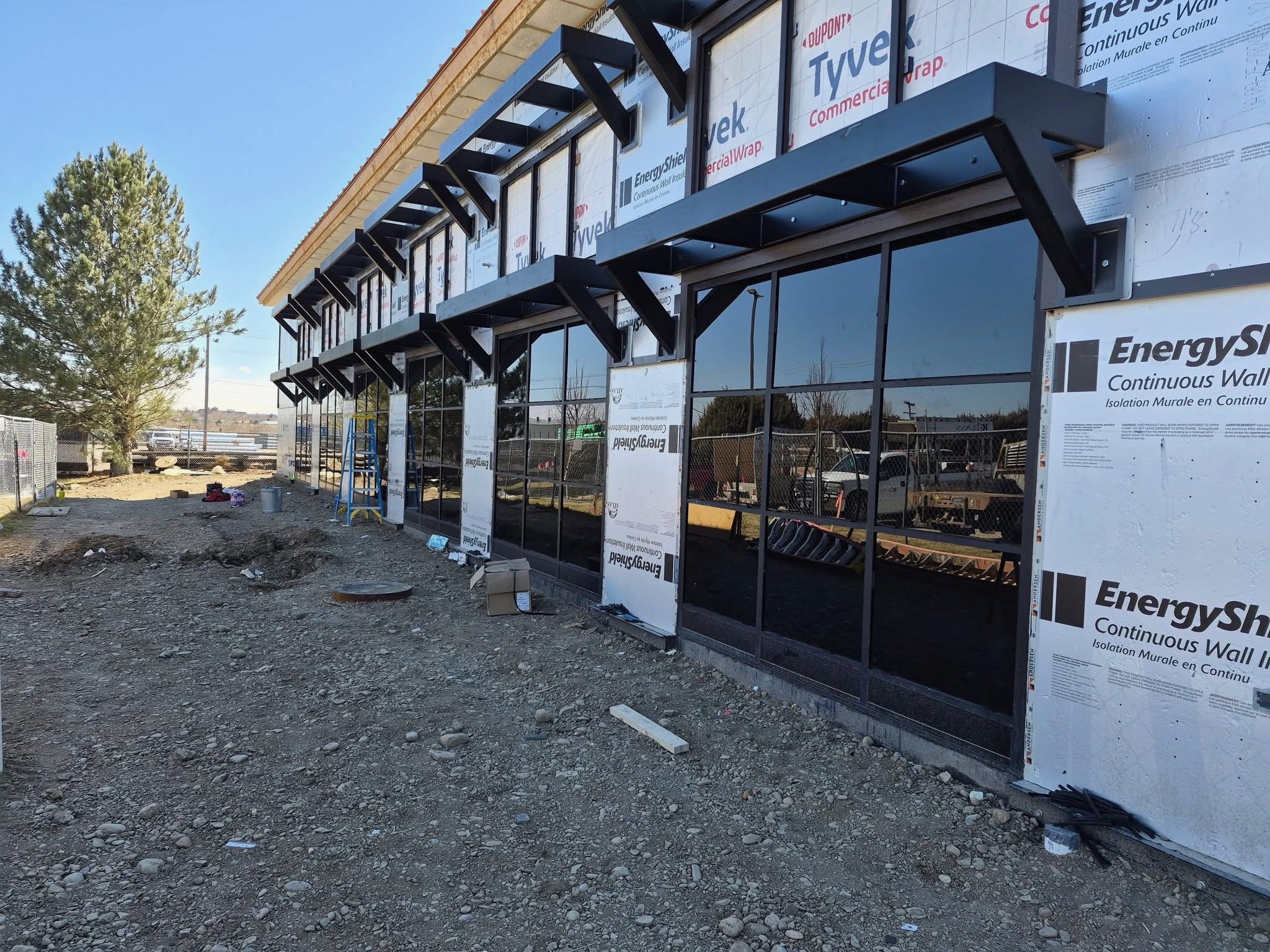 Commercial storefront glass and aluminum framing — new construction